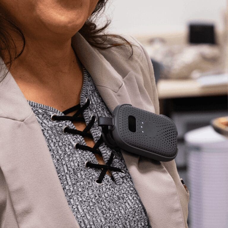 RelayM clipped to a staff member’s shirt for hands-free communication
